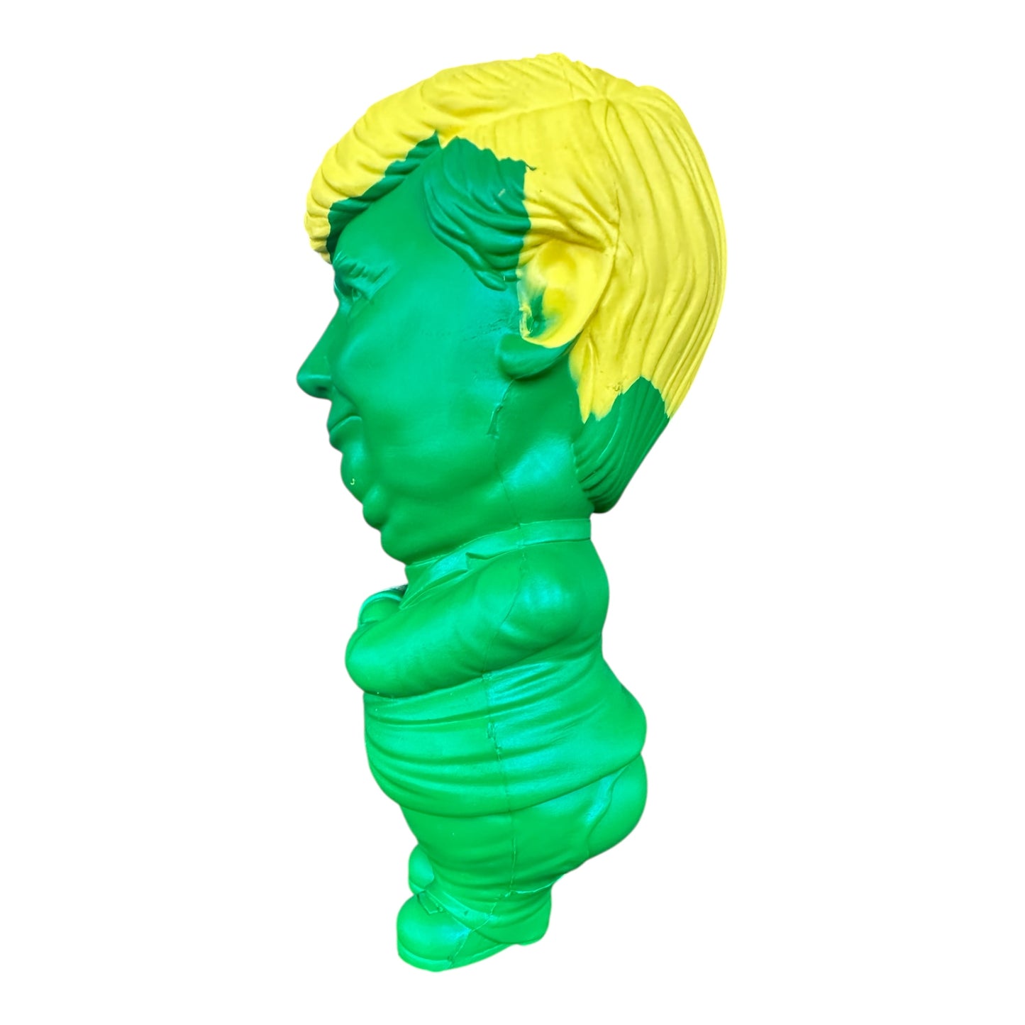 Side view of a dog chew toy shaped like Donald Trump in Green and Gold.