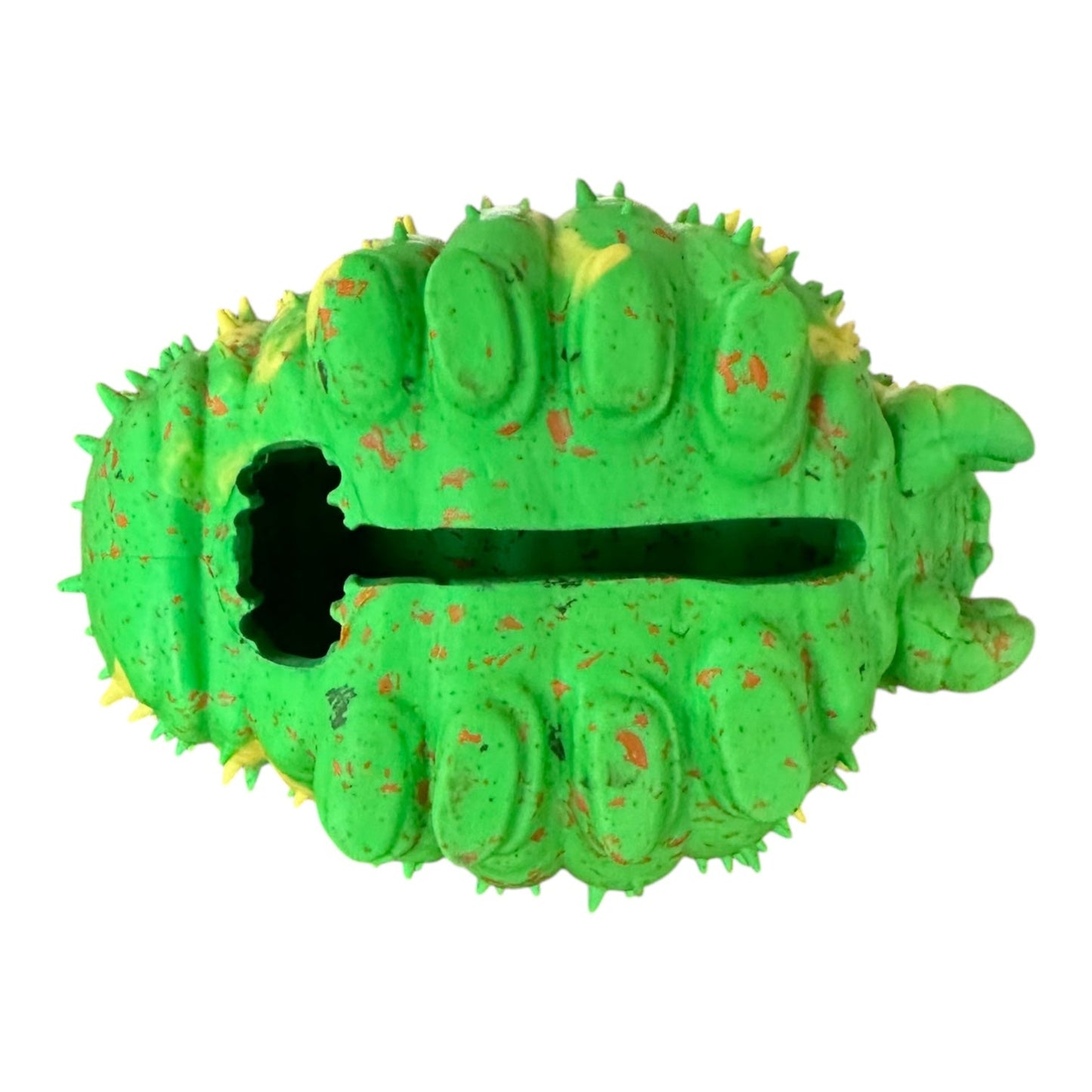 Green recycled rubber caterpillar dog toy with treat holder showing.