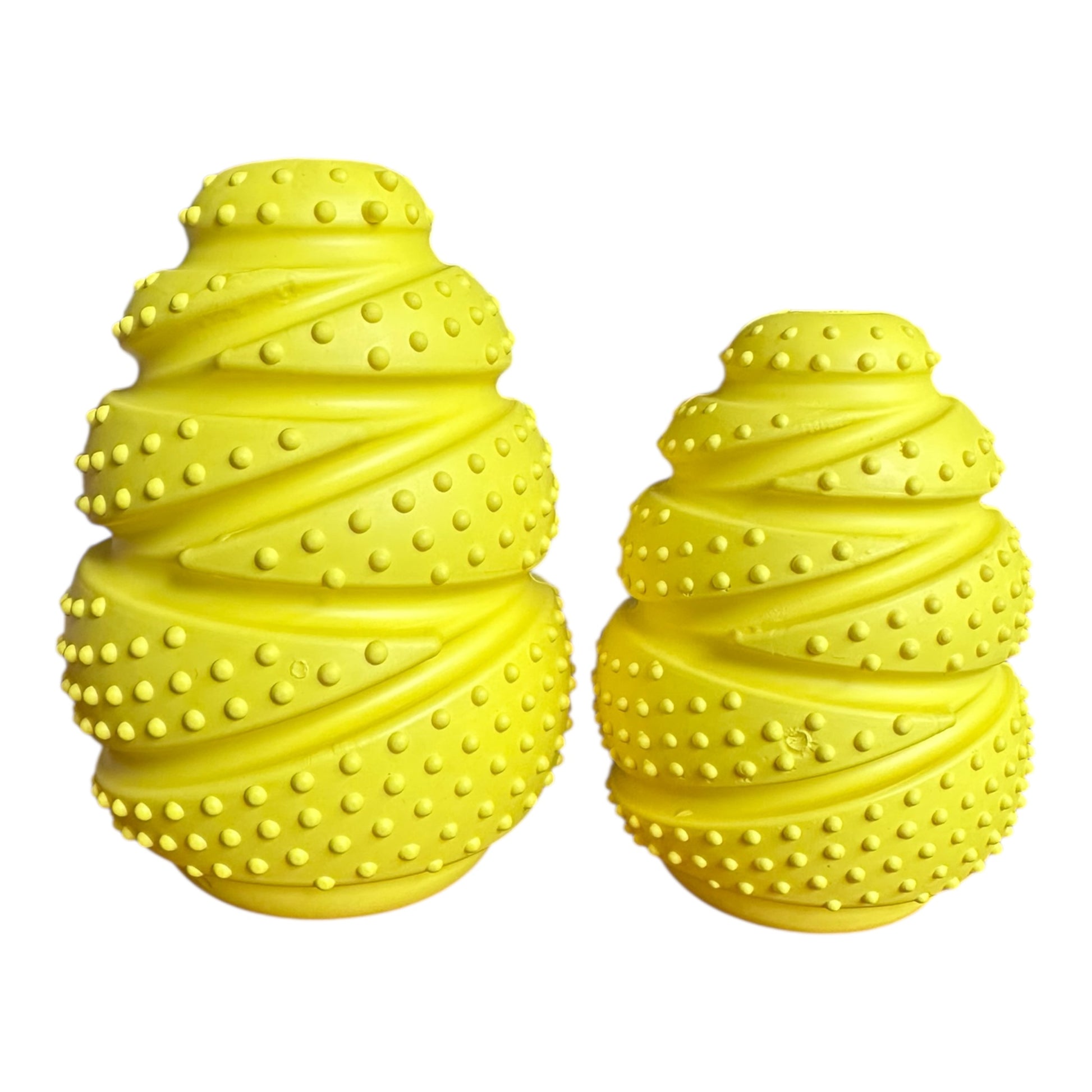 Two yellow textured dog toys on a white background