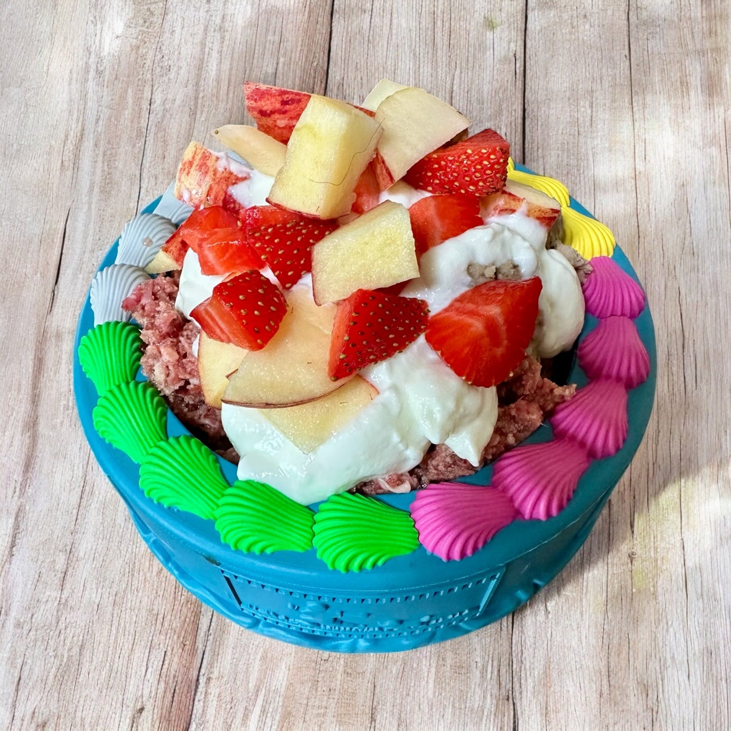 rubber birthday bowl dog toy filled with food turning the bowl into a cake