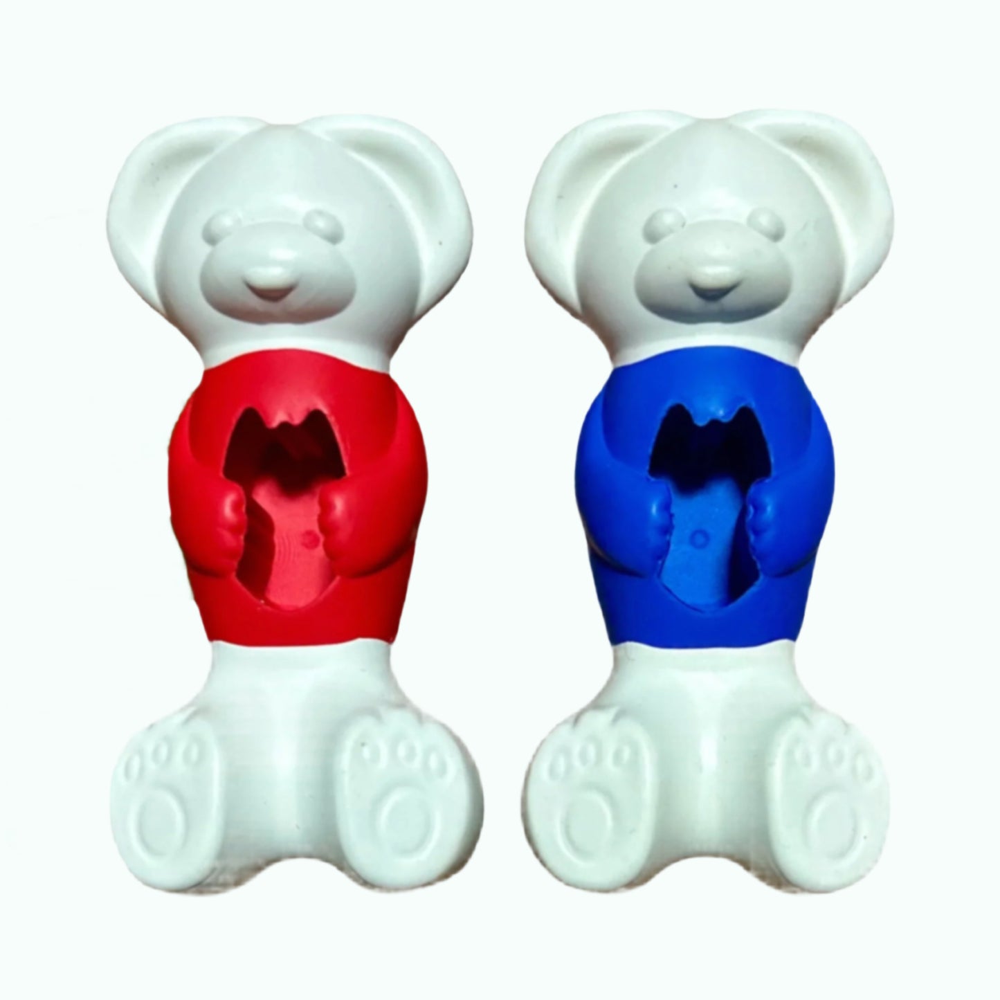 Two little rubber dog toys in the shape of a bear. One red and the other blue; both hold treats.